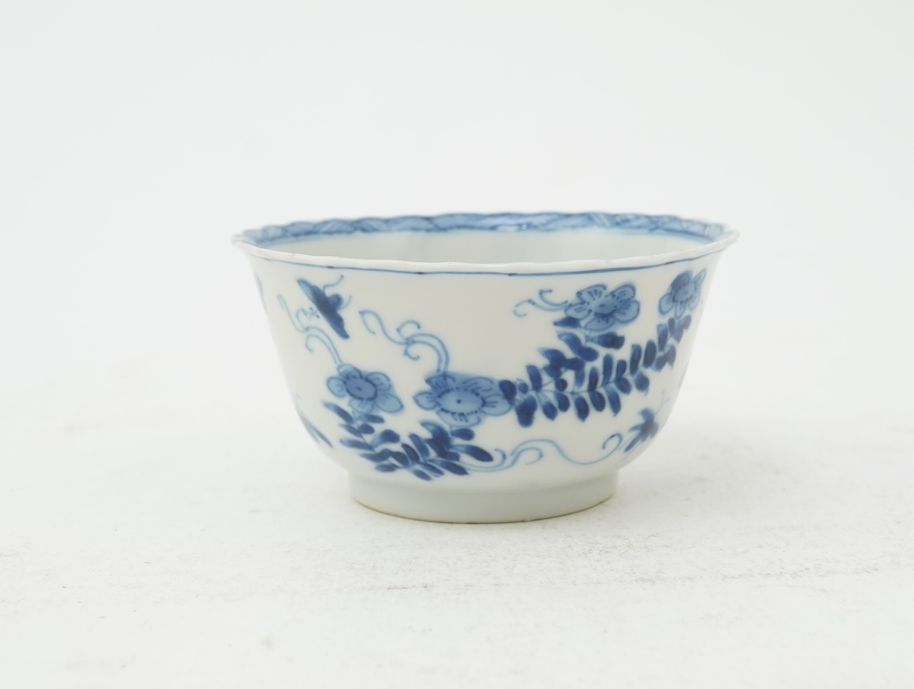 A Chinese blue and white tea bowl and saucer, Kangxi period